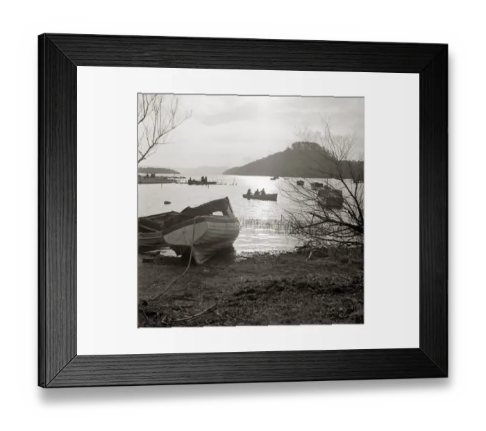 Framed Print : Rowing boats on scenic lake Row boat moored ashore by lakeside Wooded hill in Framed Print : Rowing boats on scenic lake Row boat moored ashore by lakeside Wooded hill in