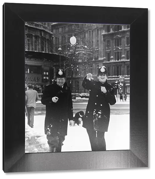 Policemen having a snow ball fight in London after a heavy snow fall January 1985