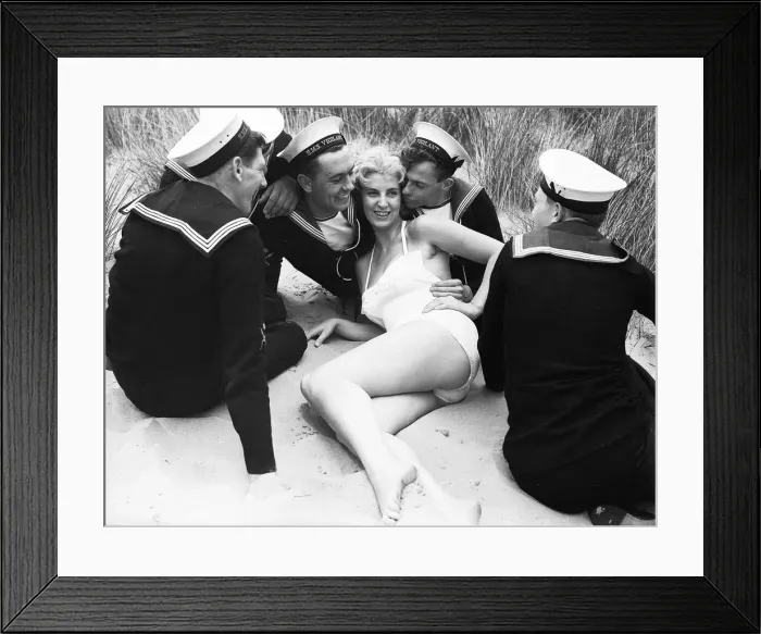 Framed Print : Girl on a beach, surronded by sailors