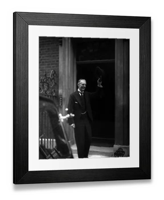  : Neville Chamberlain Prime Minister outside 10 Downing Street raises his hat to