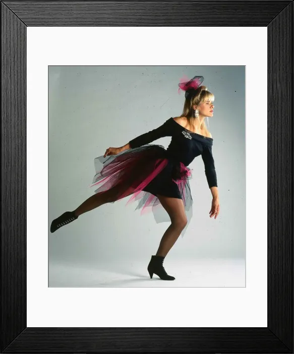 Framed Print : Carol Smillie model TV presenter wearing black dress with pink net around it Framed Print : Carol Smillie model TV presenter wearing black dress with pink net around it