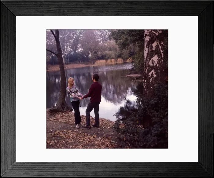 Framed Print : Young couple enjoying themselves by the lake Framed Print : Young couple enjoying themselves by the lake