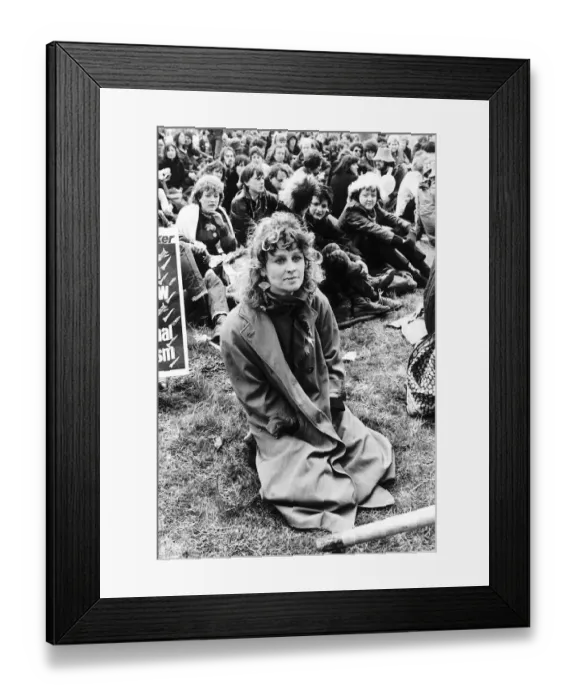 Framed Print : Julie Christie Actress sitting on grass at Greenham Common to Ban the Bomb April