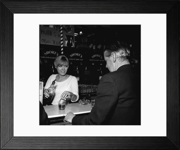Framed Print : Wendy Richard May 1966 Actress Model aged 19 years old serving behind bar near Framed Print : Wendy Richard May 1966 Actress Model aged 19 years old serving behind bar near