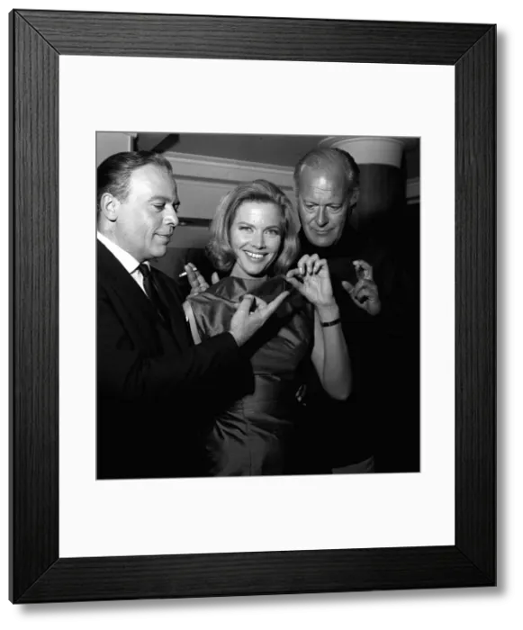 Framed Print : Actors Herbert Lom, Honor Blackman and Curt Jurgens holding thread of cotton which in Framed Print : Actors Herbert Lom, Honor Blackman and Curt Jurgens holding thread of cotton which in