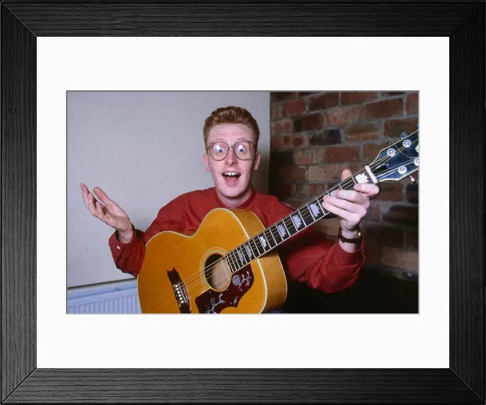 Framed Print : TV presenter Bryan Burnett playing guitar 1990 Framed Print : TV presenter Bryan Burnett playing guitar 1990