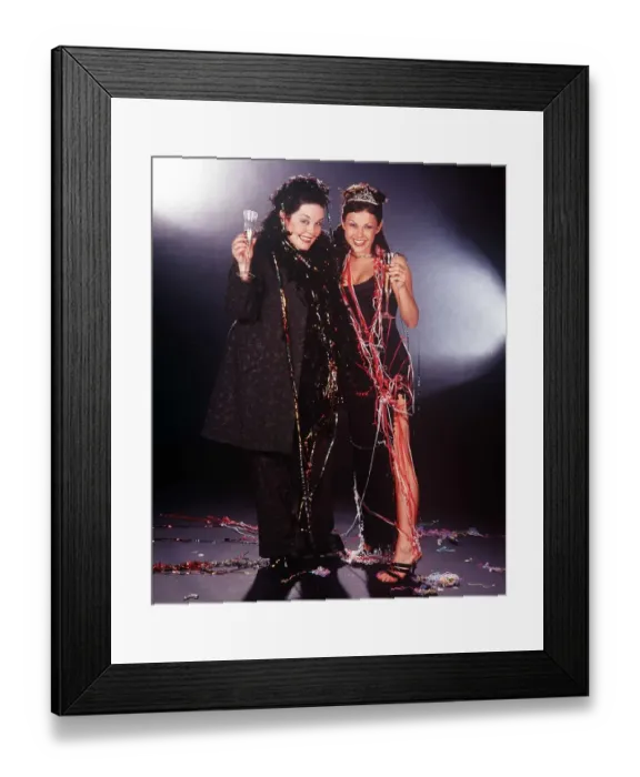 Framed Print : TV Presenter  /  actress Lisa Riley and actress Adele Silva in 1999 who both star in