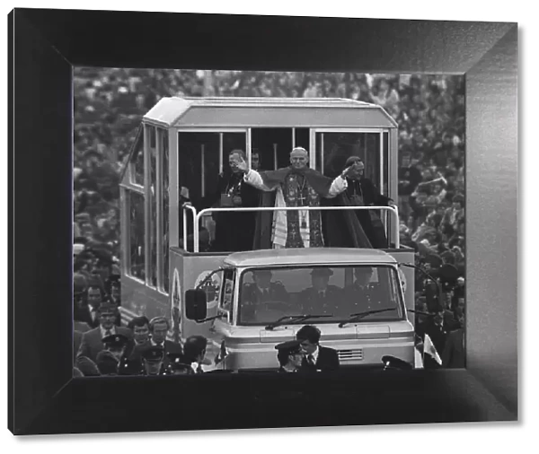 Pope John Paul II gives a blessing from his popemobile during his visit to ireland