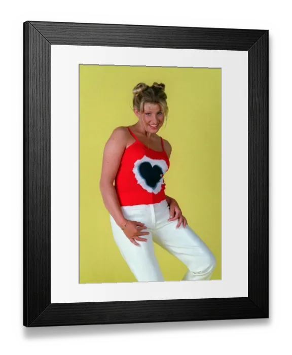 Framed Print : Alison Douglas TV presenter white trousers red vest black heart June 1996