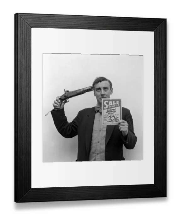 Framed Print : Spike Milligan poses for a set of pictures that represent famous film titles April Framed Print : Spike Milligan poses for a set of pictures that represent famous film titles April