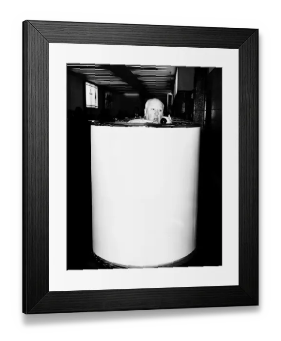 Framed Print : Alfred Hitchcock film director in a telephone booth in Heathrow Airport brochure