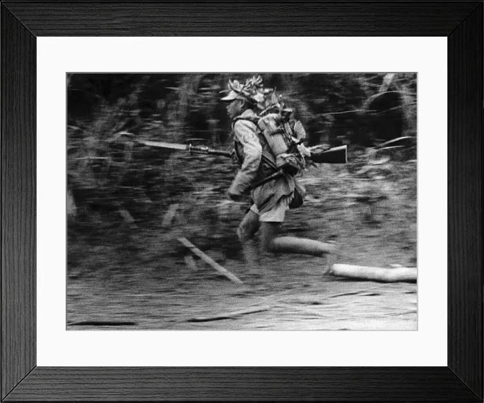 Framed Print : WW2 Chinese infantry soldier advances along a roadside in Burma Framed Print : WW2 Chinese infantry soldier advances along a roadside in Burma