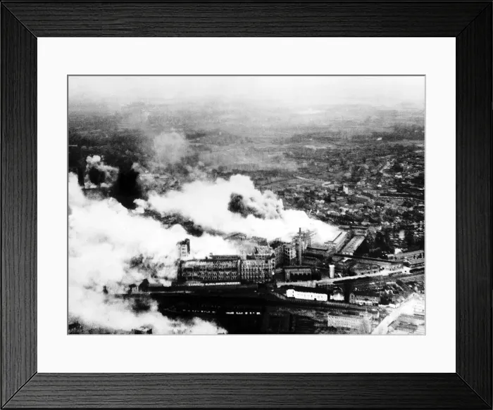 Framed Print : Smoke pours from The Philips radio valve works in Eidhoven Holland after a daylight raid Framed Print : Smoke pours from The Philips radio valve works in Eidhoven Holland after a daylight raid