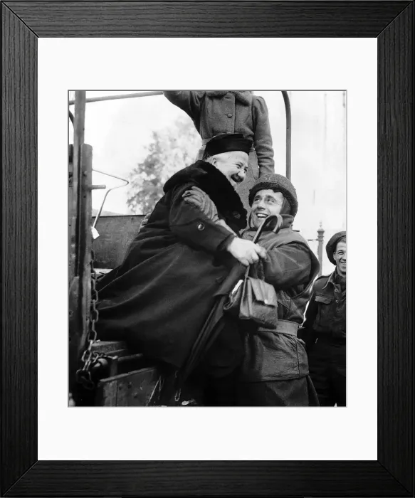 Framed Print : WW2 A British soldier helps an elderly Dutch evacuee down from an army lorry Framed Print : WW2 A British soldier helps an elderly Dutch evacuee down from an army lorry