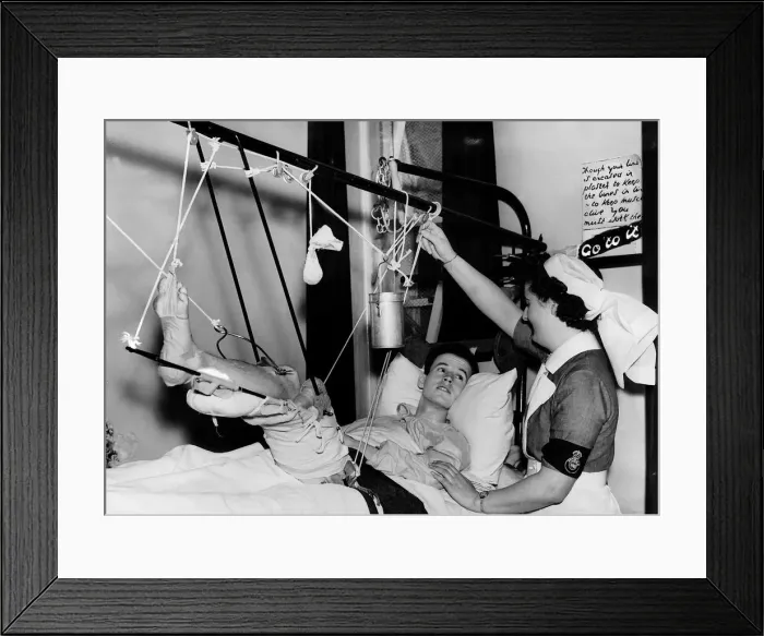 Framed Print : British pilot with a fractured thigh talks to a nurse from his hospital bed Framed Print : British pilot with a fractured thigh talks to a nurse from his hospital bed