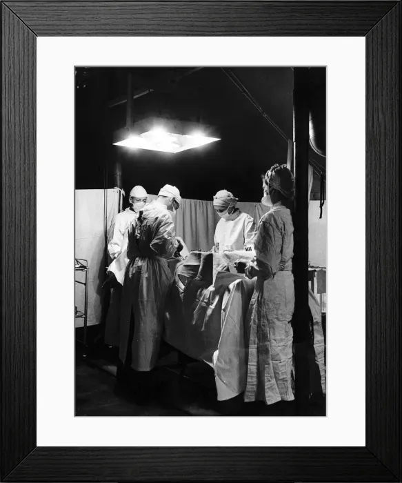 Framed Print : Doctors at work in the operating theatre of a field hospital in Normandy during WW2 Framed Print : Doctors at work in the operating theatre of a field hospital in Normandy during WW2