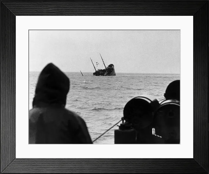 Framed Print : WW2 A British corvette sinks below the waves after hitting a mine dropped in Framed Print : WW2 A British corvette sinks below the waves after hitting a mine dropped in