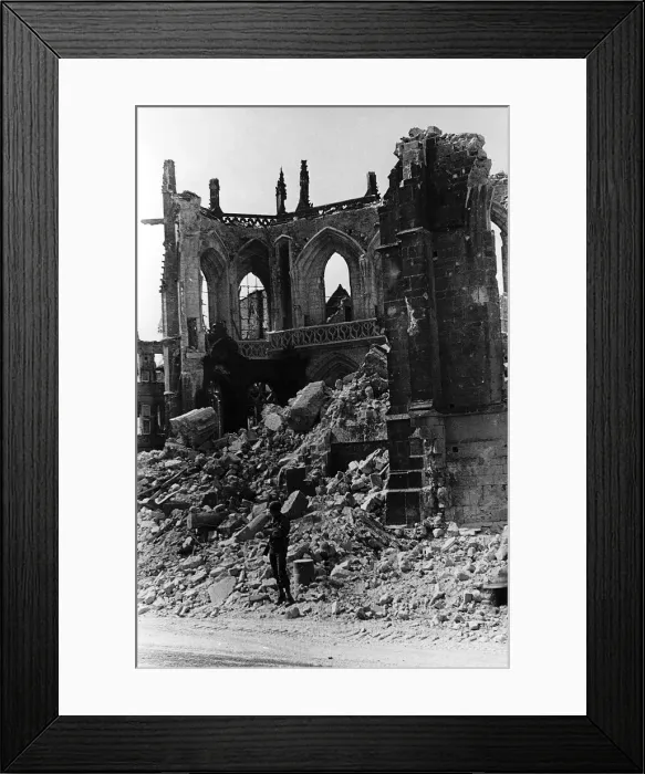 Framed Print : US Military Policeman guards the ruins of the Cathedral of Valognes against looters after