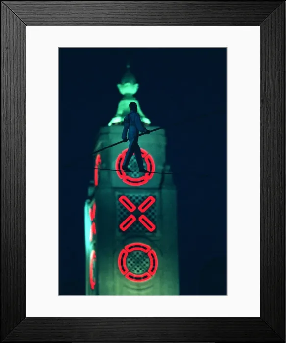 Framed Print : Didier Pasquette a tightrope walker silhouetted against the Oxo Tower in action above Framed Print : Didier Pasquette a tightrope walker silhouetted against the Oxo Tower in action above