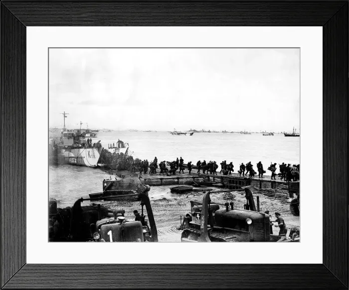 Framed Print : British troops arrive at Juno beach Normandy as part of the invasion force against Framed Print : British troops arrive at Juno beach Normandy as part of the invasion force against