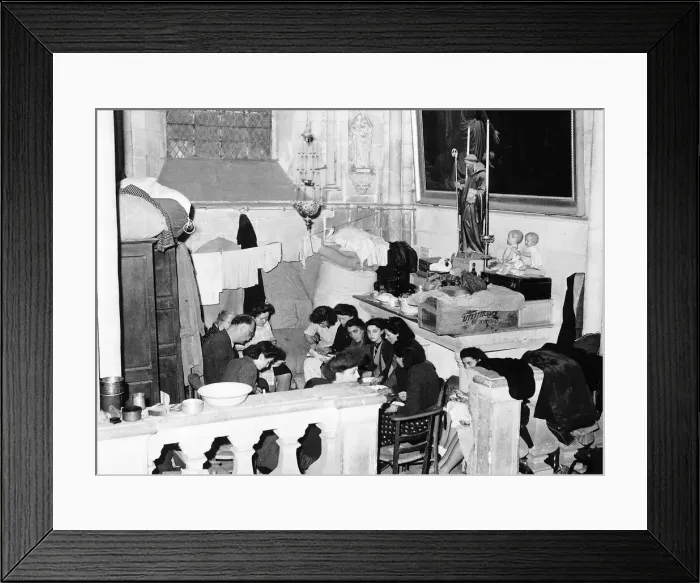 Framed Print : WW2 - Hundreds of refugees have been living in Caen Cathedral in the aisles