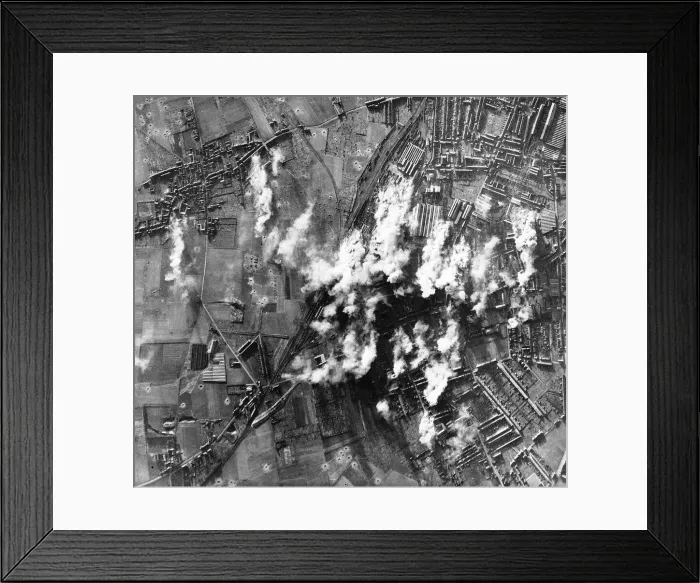 Framed Print : Smoke rises from the steel & engineering works at Lille in France during WW2 bombing raid Framed Print : Smoke rises from the steel & engineering works at Lille in France during WW2 bombing raid