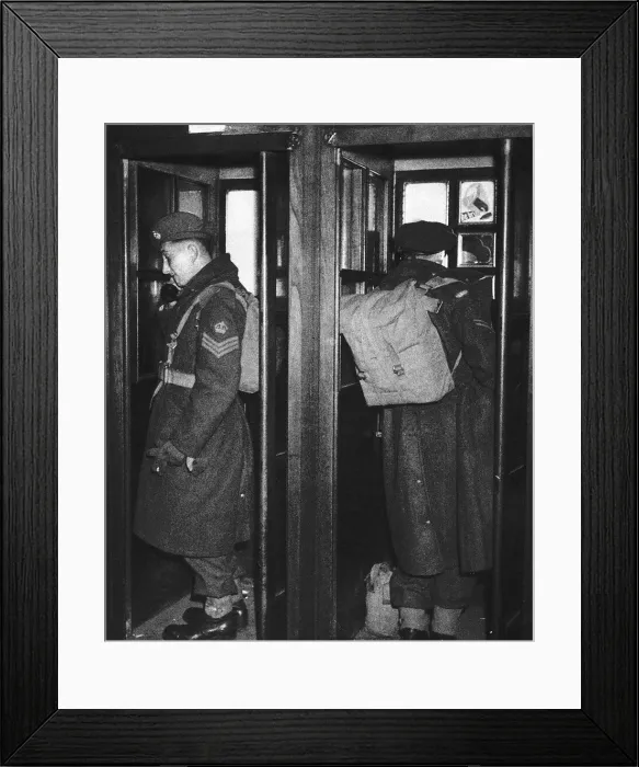 Framed Print : WW2 soldiers make phone calls telling their families that they are back in England 1945 Framed Print : WW2 soldiers make phone calls telling their families that they are back in England 1945