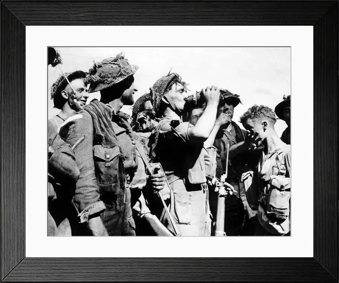 Framed Print : WW2 British soldier drinks from his waterbottle 1944