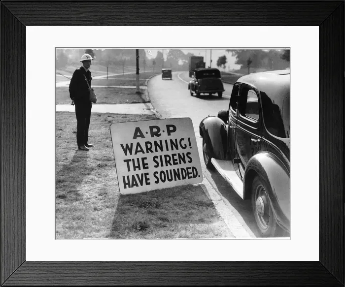 Framed Print : WW2 Air raid warden by road side Sept 40 warning notice for road users Framed Print : WW2 Air raid warden by road side Sept 40 warning notice for road users