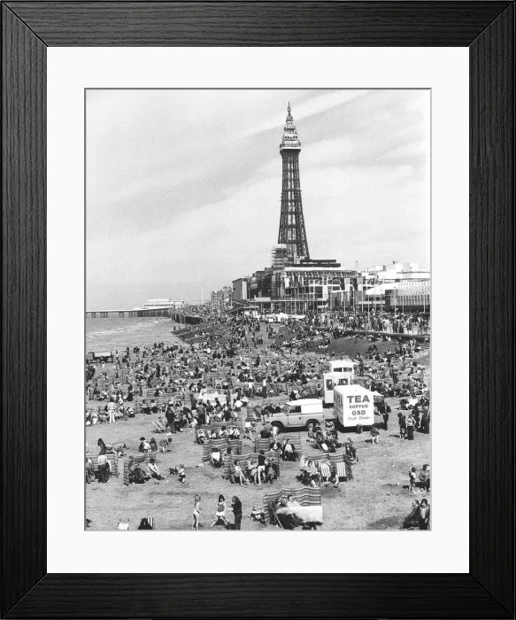 Framed Print : Blackpool Tower with people sitting on Blackpool Beach