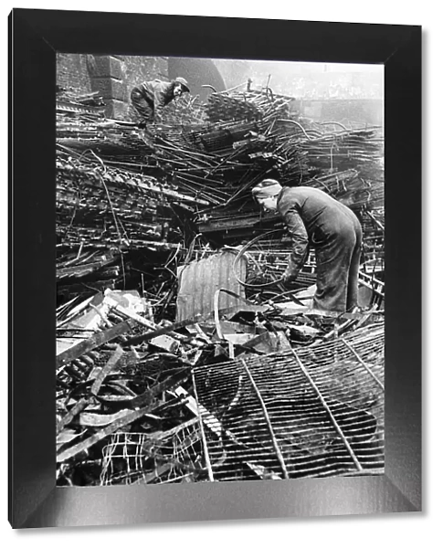 Women scrap locators from the Ministry of Works prepare metal for recycling. WW2