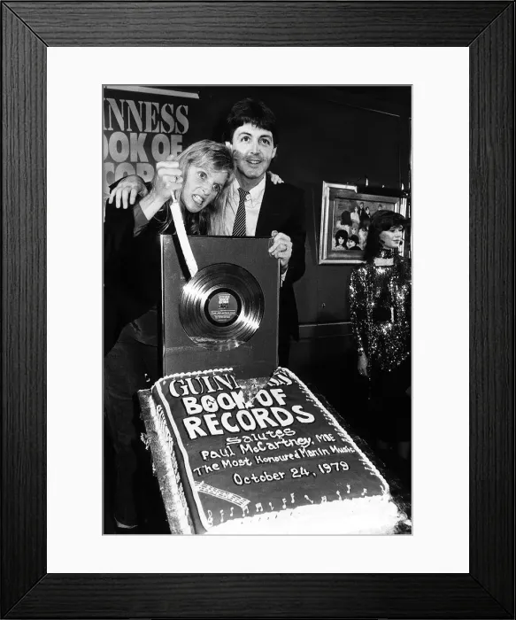 Framed Print : Paul McCartney former singer with The Beatles and wife Linda at the Guinness book of Framed Print : Paul McCartney former singer with The Beatles and wife Linda at the Guinness book of