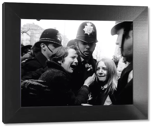Upset Beatles fans crying because Paul McCartney got married are led away by police