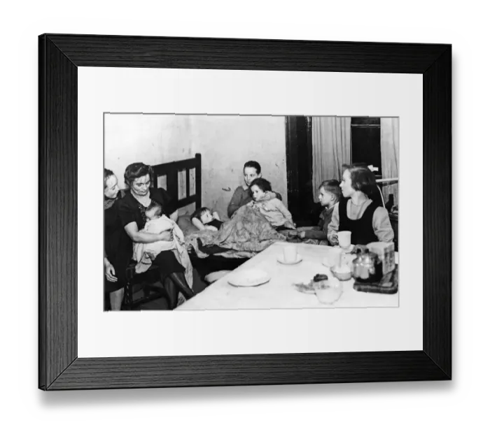 Framed Print : A mother and her family seen here living in one room of a Liverpool Terrace slum