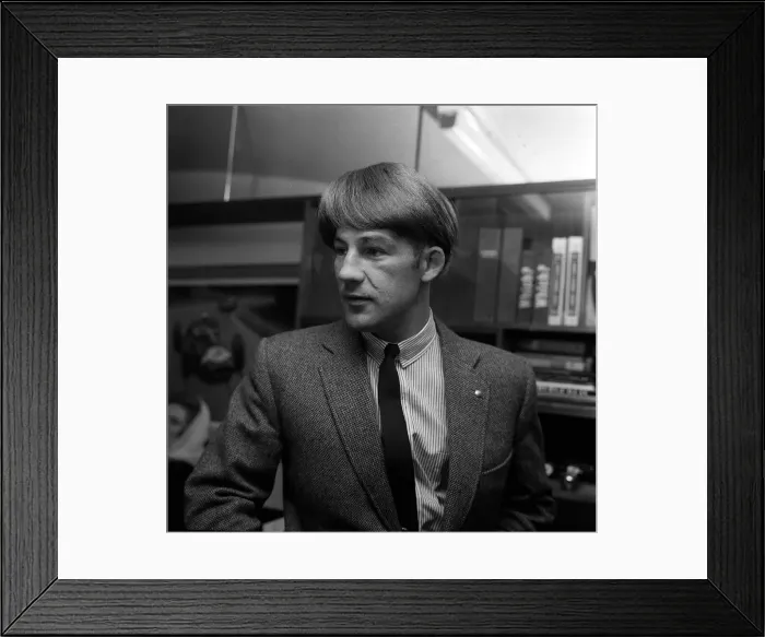 Framed Print : British motor racing driver Stirling Moss wearing a Beatles wig, November 1963 Framed Print : British motor racing driver Stirling Moss wearing a Beatles wig, November 1963