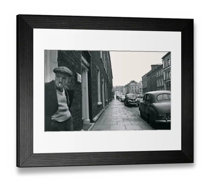 Framed Print : An old man standing in a doorway, smoking Street scene Georgian buildings Framed Print : An old man standing in a doorway, smoking Street scene Georgian buildings