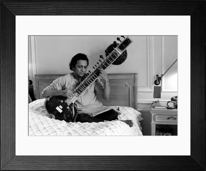 Framed Print : Ravi Shankar playing the sitar in his suite at the Savoy Hotel Framed Print : Ravi Shankar playing the sitar in his suite at the Savoy Hotel