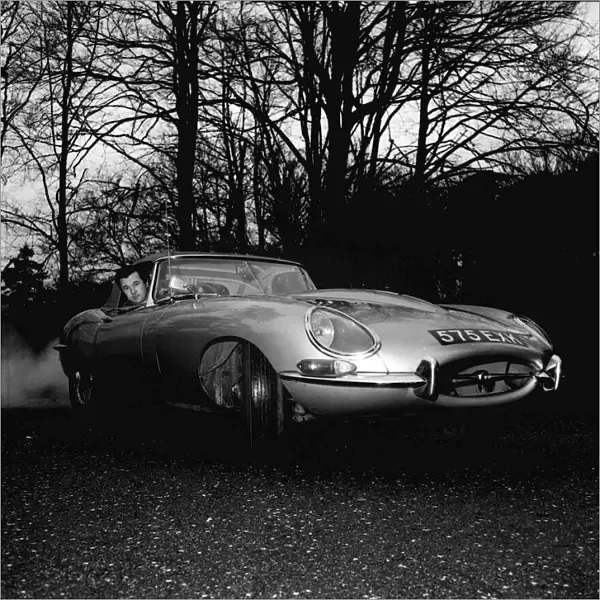 Bryan Forbes January 1964 in his E-type Jaguar