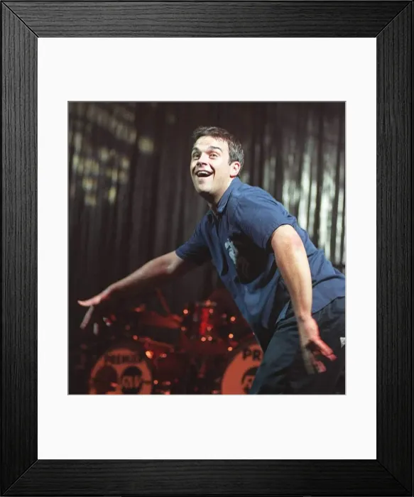 Framed Print : Robbie Williams dances at his concert at the SECC Glasgow February 1999 Framed Print : Robbie Williams dances at his concert at the SECC Glasgow February 1999