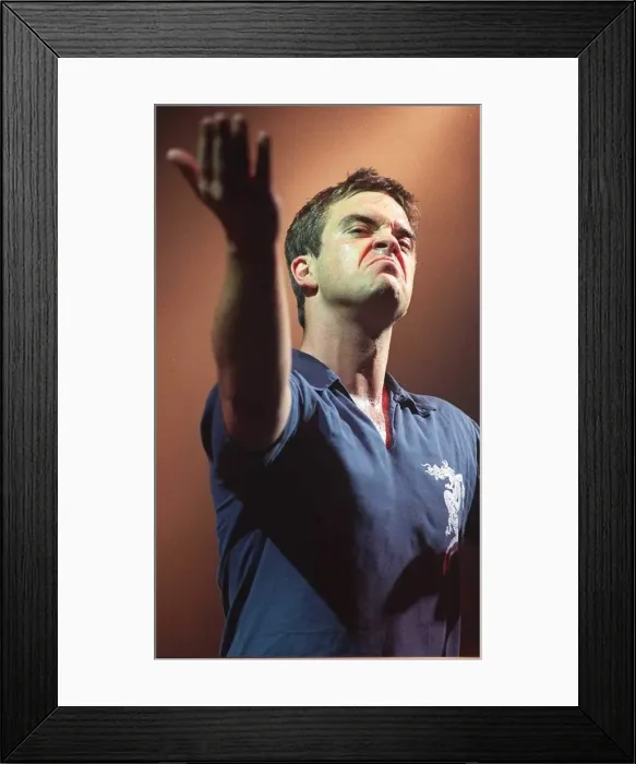 Framed Print : Robbie Williams makes a face to the audience at his concert at the SECC Glasgow February Framed Print : Robbie Williams makes a face to the audience at his concert at the SECC Glasgow February