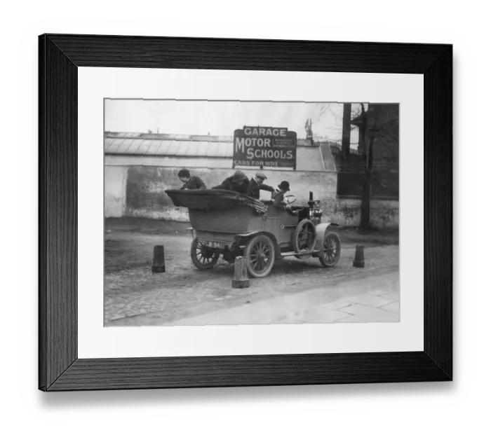 Framed Print : Daily Mirror Man v Woman Motor Test February 1914 A lady reverses a car through Framed Print : Daily Mirror Man v Woman Motor Test February 1914 A lady reverses a car through