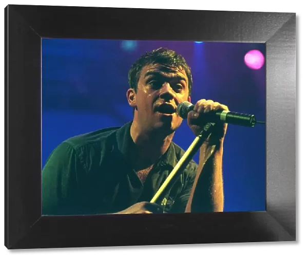 Robbie Williams sings at his concert at the SECC Glasgow February 1999