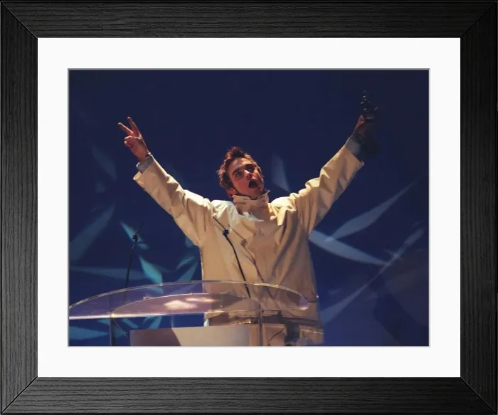Framed Print : Robbie Williams formerly of Take That presenting an award at the Brit Awards 1996