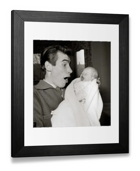 Framed Print : Jim Dale holds his new born baby girl Jane Belinda after her birth at a nursing home in Framed Print : Jim Dale holds his new born baby girl Jane Belinda after her birth at a nursing home in