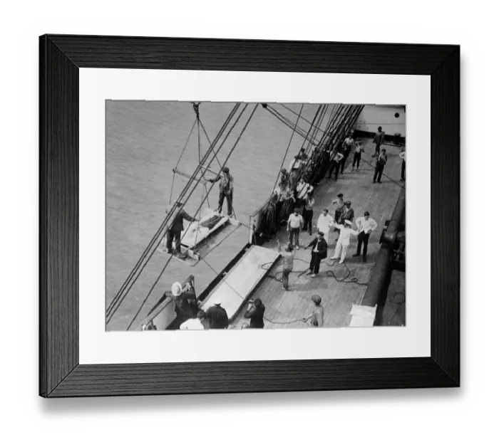 Framed Print : World War One. A wounded man on a stretcher is lifted on board a hospital ship Framed Print : World War One. A wounded man on a stretcher is lifted on board a hospital ship