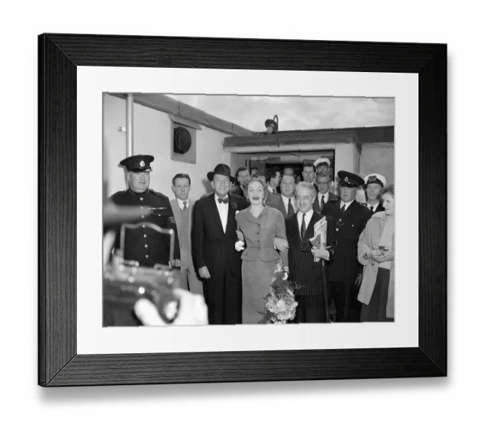 Framed Print : Marlene Dietrich arriving in London for Cabaret actress surrounded by men