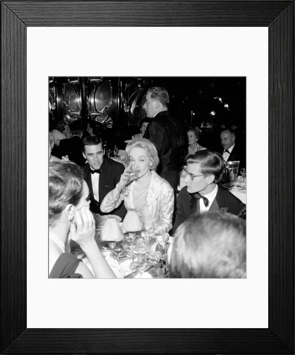 Framed Print : Marlene Dietrich with Yves St. Laurant in Paris sitting at dinner table in Framed Print : Marlene Dietrich with Yves St. Laurant in Paris sitting at dinner table in