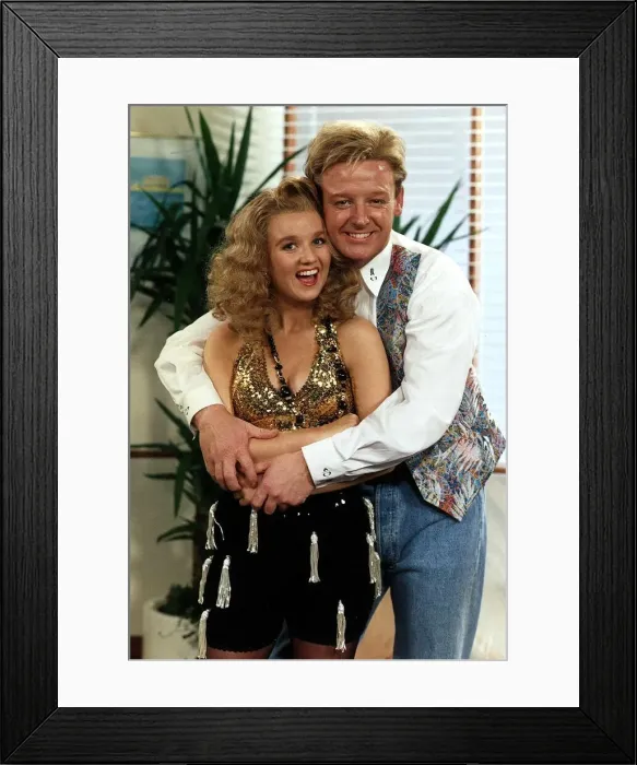 Framed Print : Les Dennis Comedian and TV presenter wraps his arms around Comediene LIsa Maxwell Framed Print : Les Dennis Comedian and TV presenter wraps his arms around Comediene LIsa Maxwell