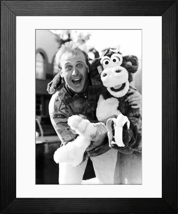 Framed Print : Mike Brosnan TV presenter with Chuck the Chimpanzee Framed Print : Mike Brosnan TV presenter with Chuck the Chimpanzee