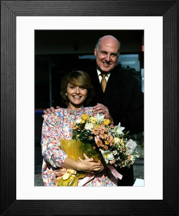 Framed Print : Anne Diamond TV presenter holding a bouquet of flowers Framed Print : Anne Diamond TV presenter holding a bouquet of flowers